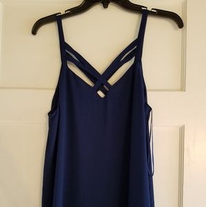 Navy blue blouse, crisscross front and back.